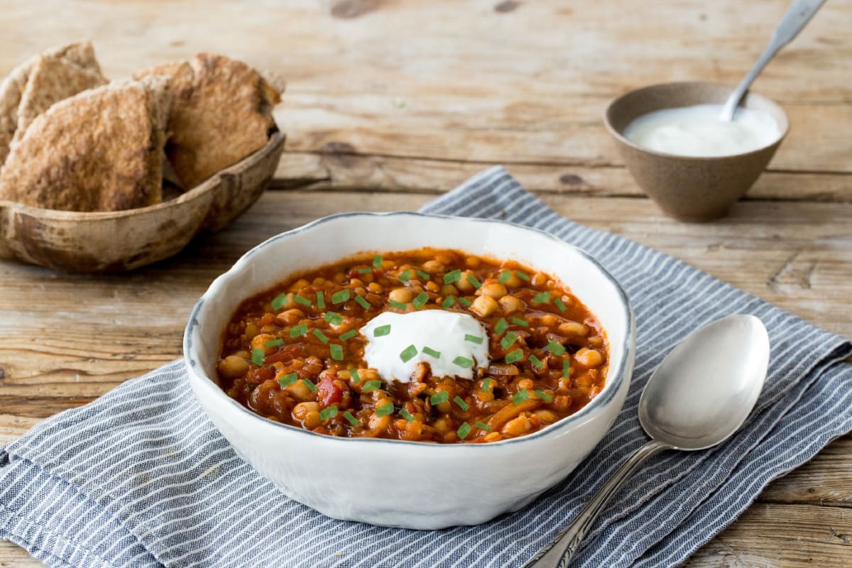 Spiced Moroccan Lentil and Chickpea Soup with Sour Cream and Toasted Pita