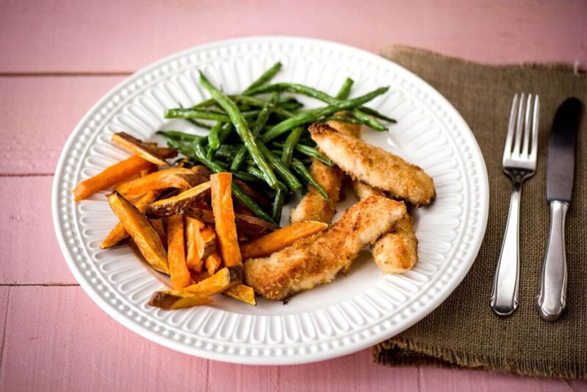 Coconut-Crusted Chicken Fingers with Garlic Green Beans and Spiced Sweet Potato Fries