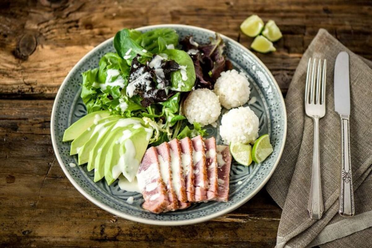 Sesame-Crusted Tuna Tataki Salad with Rice Balls, Avocado, and Wasabi-Lime Dressing