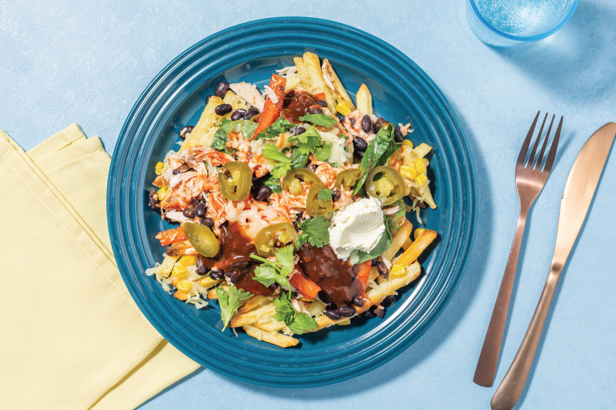 Tex-Mex Chicken & Black Bean Loaded Fries with Cheddar Cheese, Pickled Jalapeños & Sour Cream