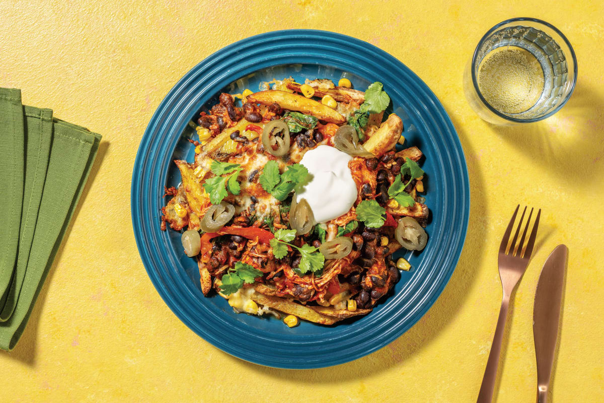 Tex-Mex Chicken & Black Bean Loaded Fries with Cheddar Cheese, Pickled Jalapeños & Sour Cream