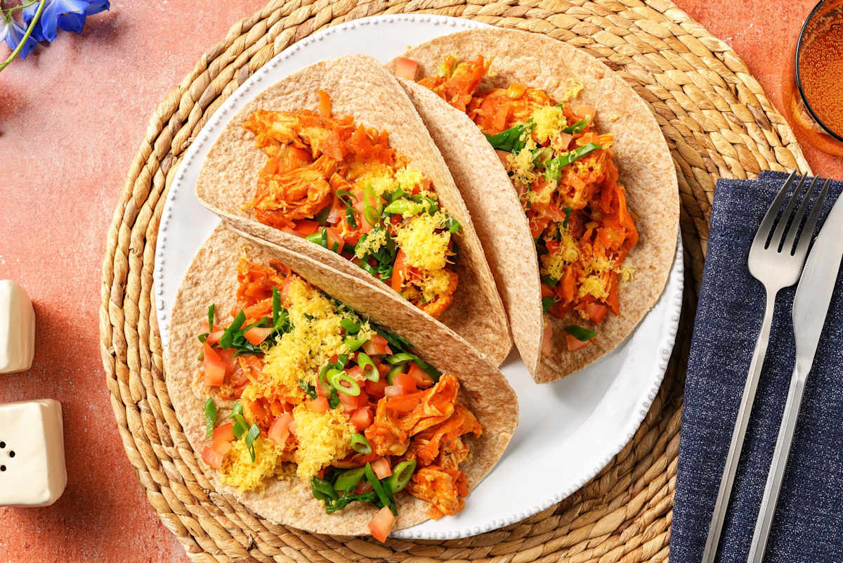 Smokey pulled chicken taco's met geraspte kaas