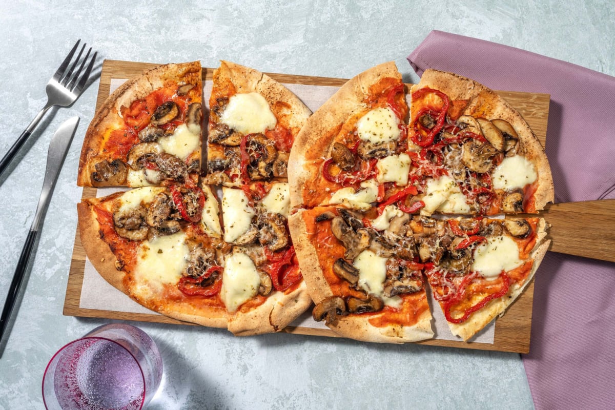 Pizza sur pain aux champignons blonds et mozzarella