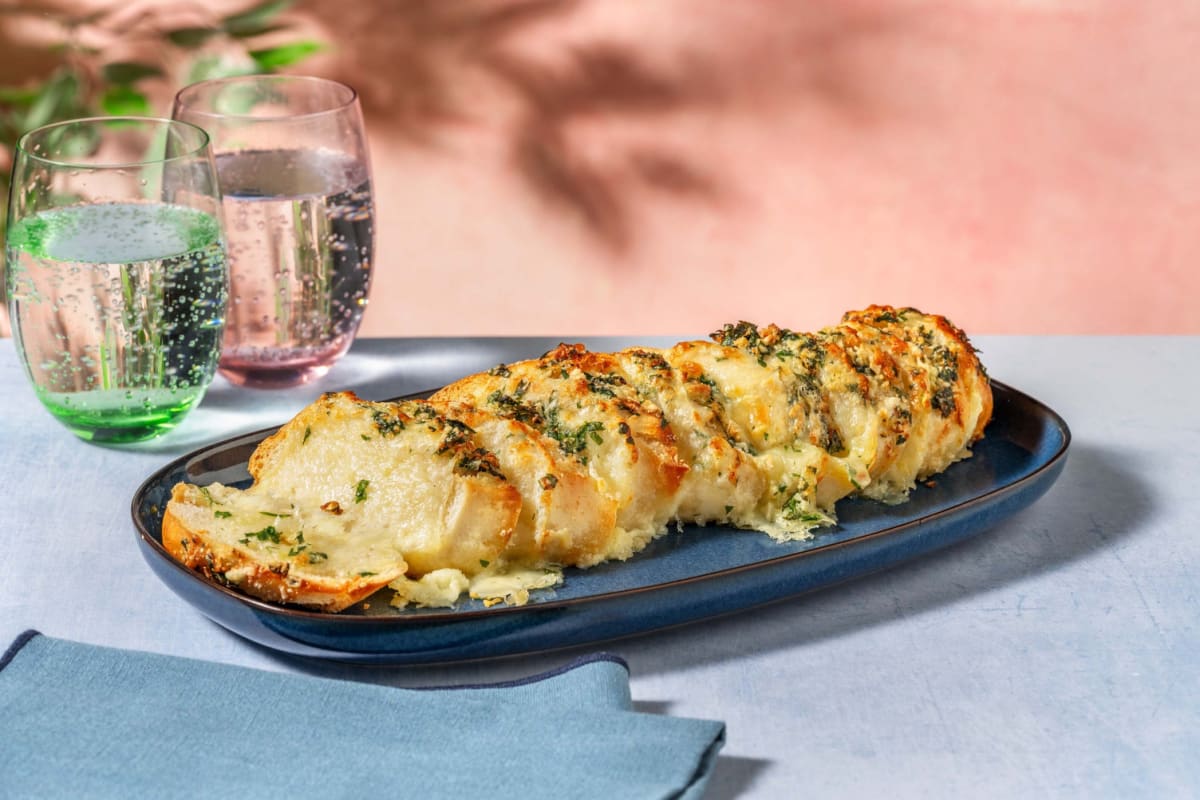 Cheesy Herby Hasselback Garlic Baguette