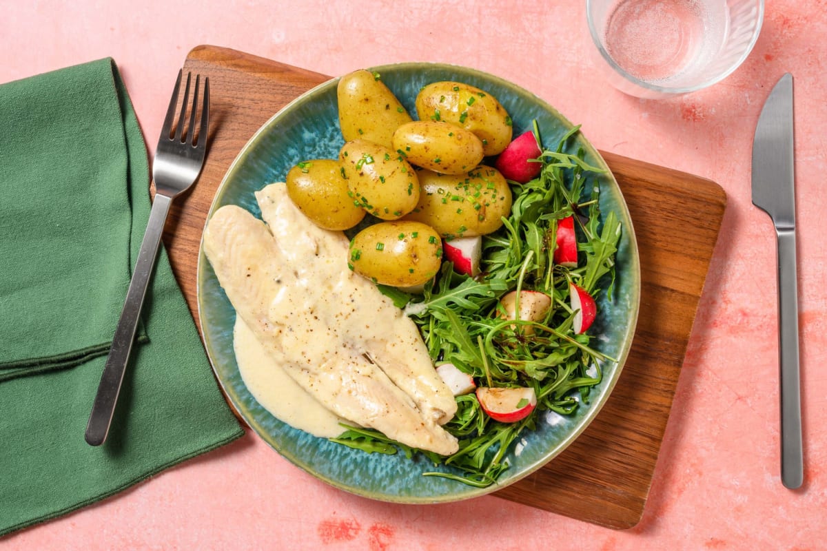 Pan fried saithe in a cheesy cream sauce