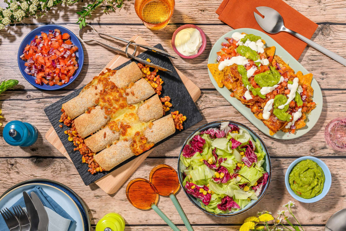 Kip-enchilada's en pikante nacho's met avocadodip