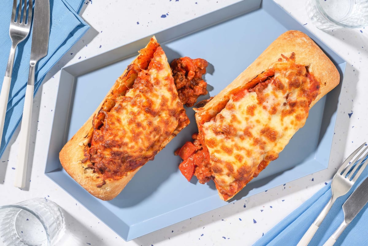 Baked bolognese stuffed baguette