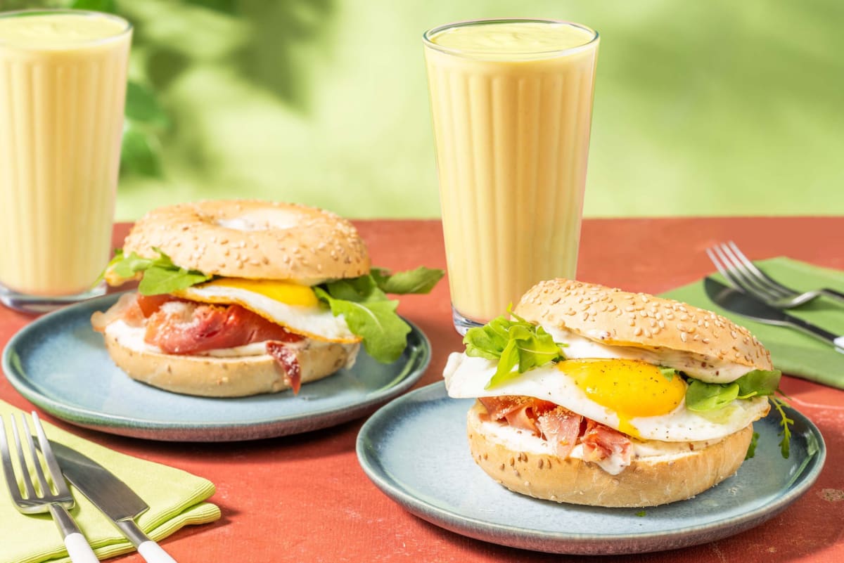 Cheesy breakfast prosciutto bagel and tropical smoothie