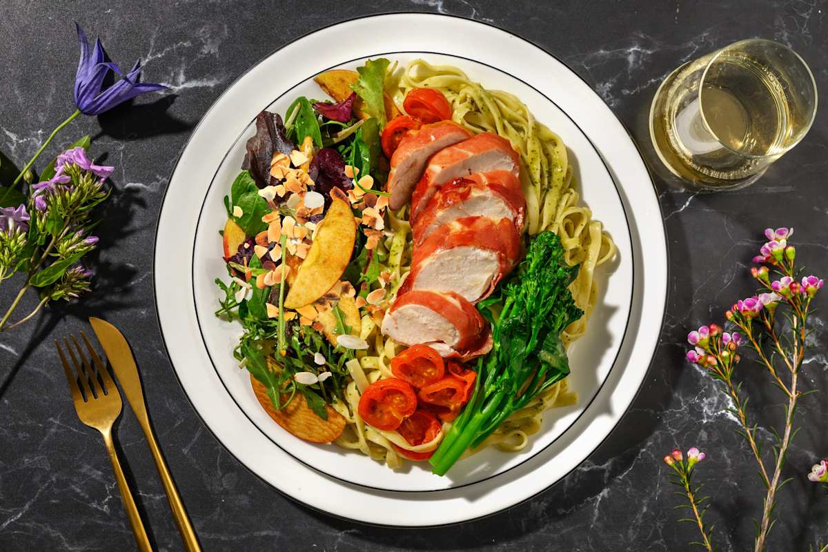 Serrano Ham Wrapped Chicken on Roasted Tomato Tagliatelle