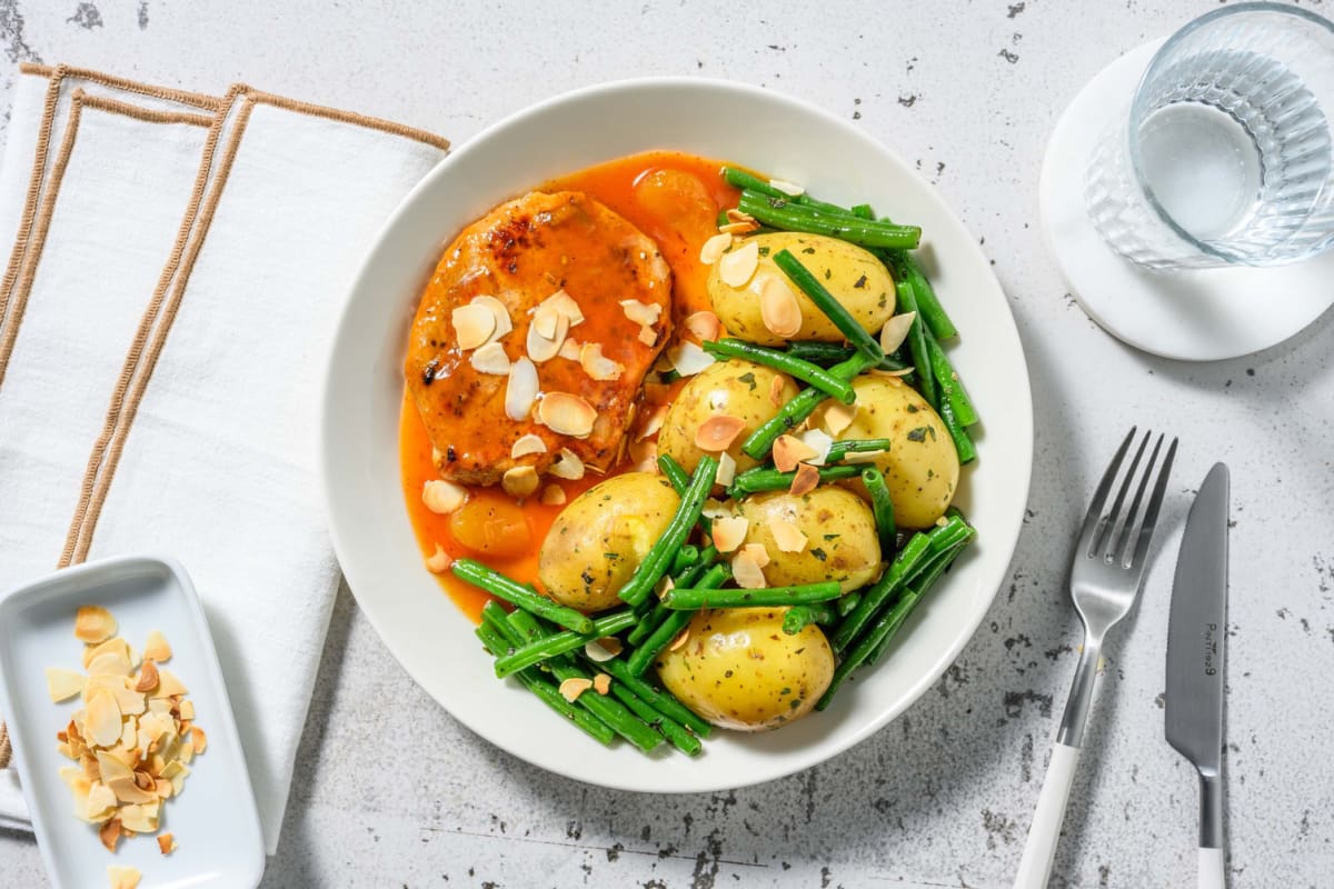 Gebratenes Schweinelachssteak mit Butterbohnen