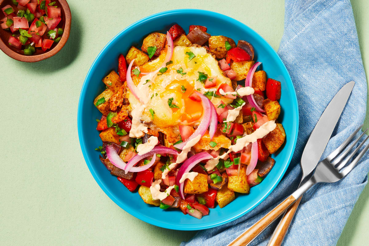 Cheesy Fried Eggs over Nacho Potato Hash