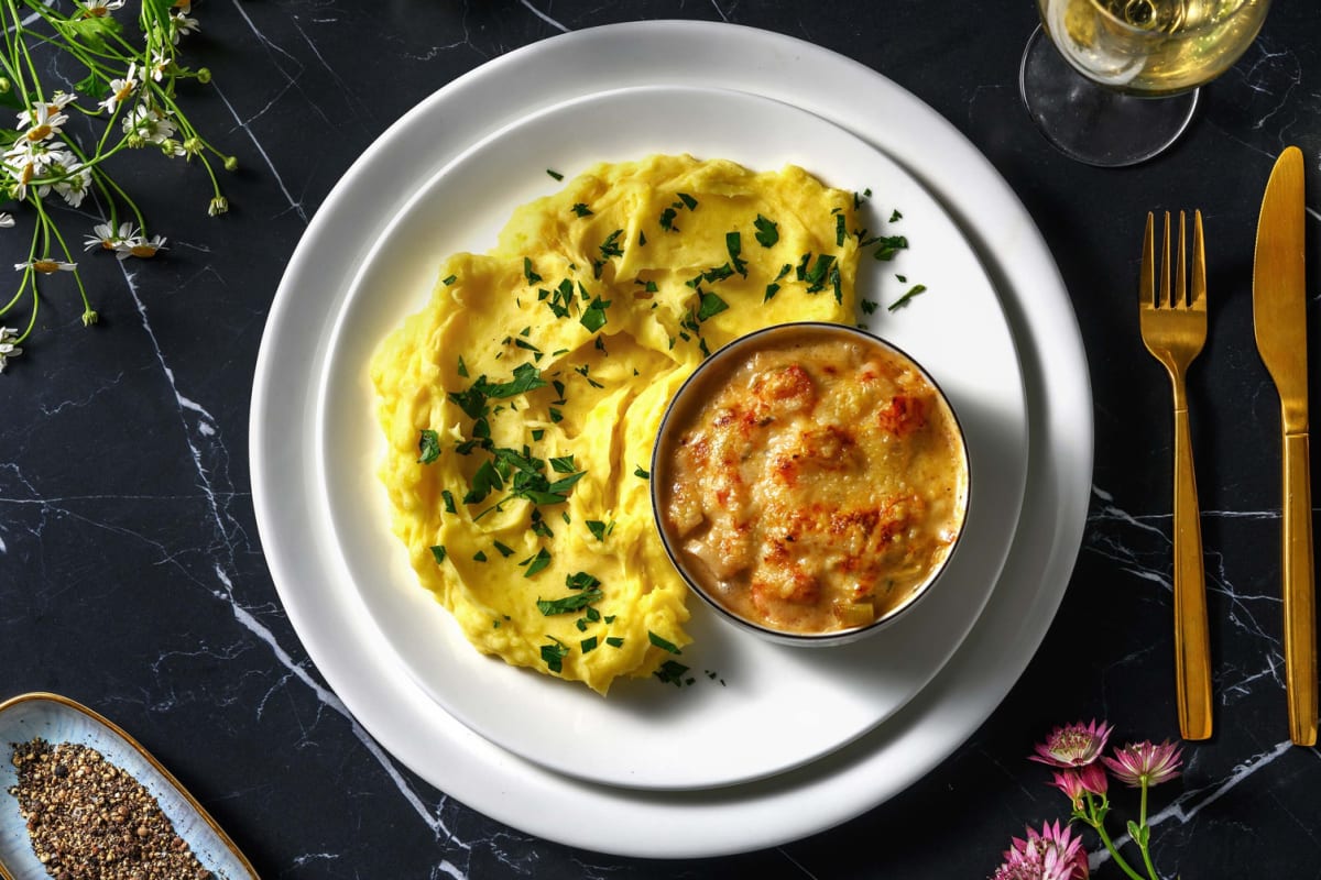 Visgratin van kabeljauw, koolvis, zalm en garnalen