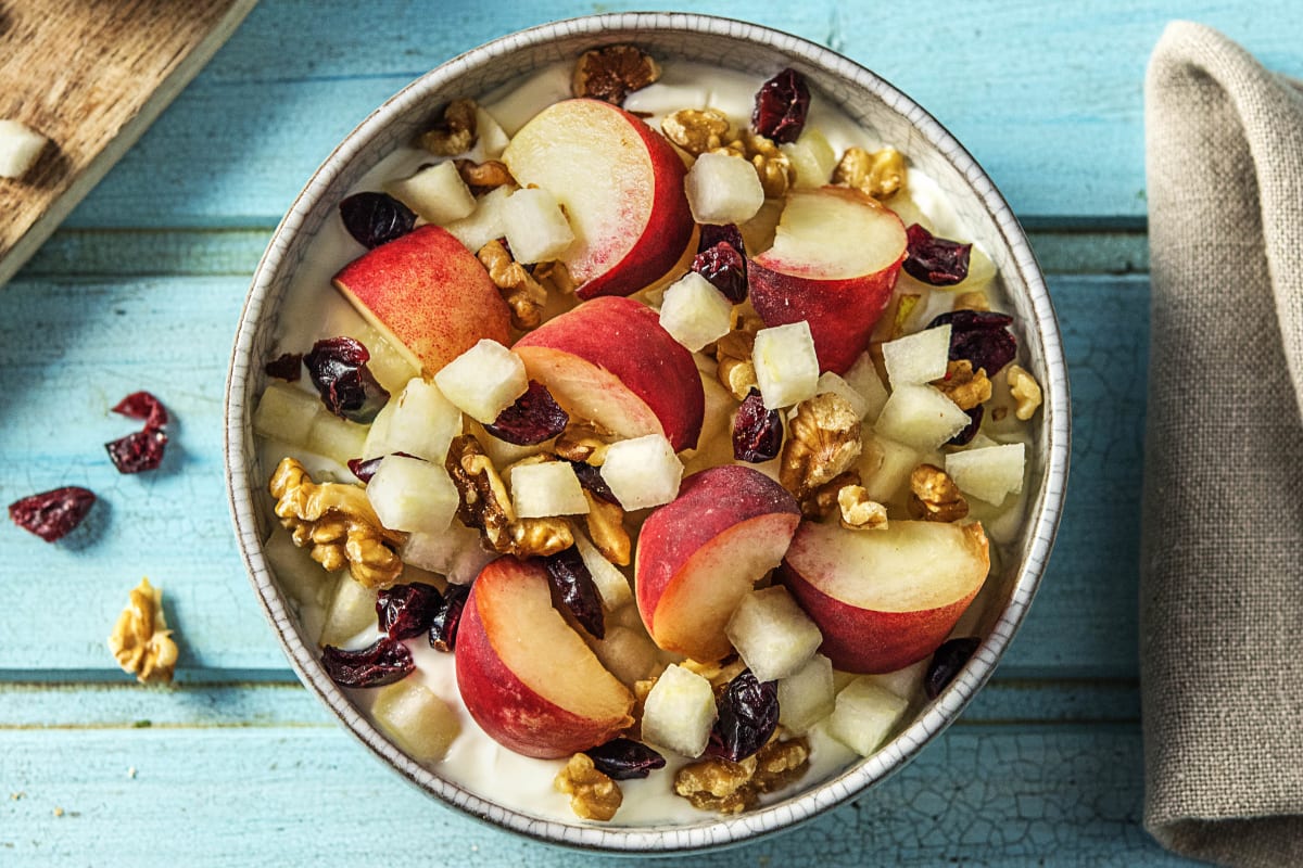 Halfvolle yoghurt met peer, perzik en noten-rozijnenmix