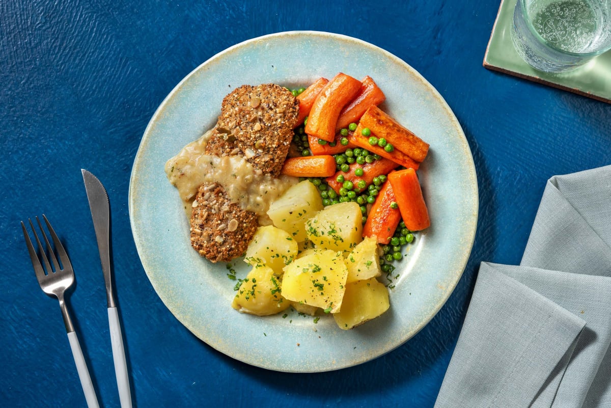 Escalope de poisson panée aux céréales et petits pois-carottes