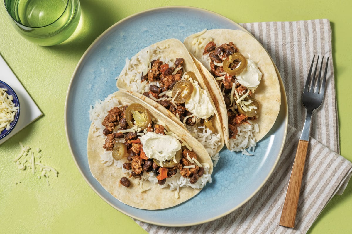 https://img.hellofresh.com/f_auto,fl_lossy,q_auto,w_1200/hellofresh_s3/image/quick-beef-bean-taco-rittos-19ac3171.jpg