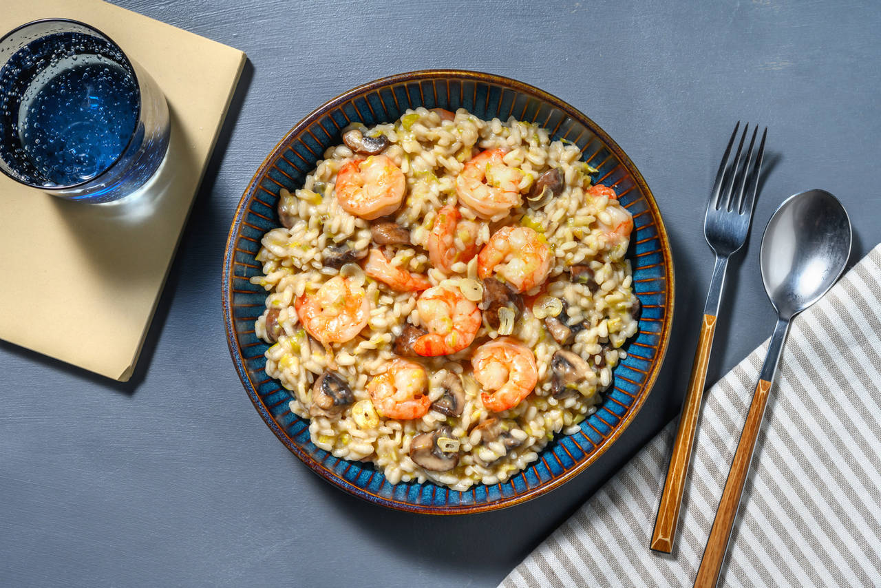 Risotto cremoso de langostinos con setas portobello y queso italiano curado