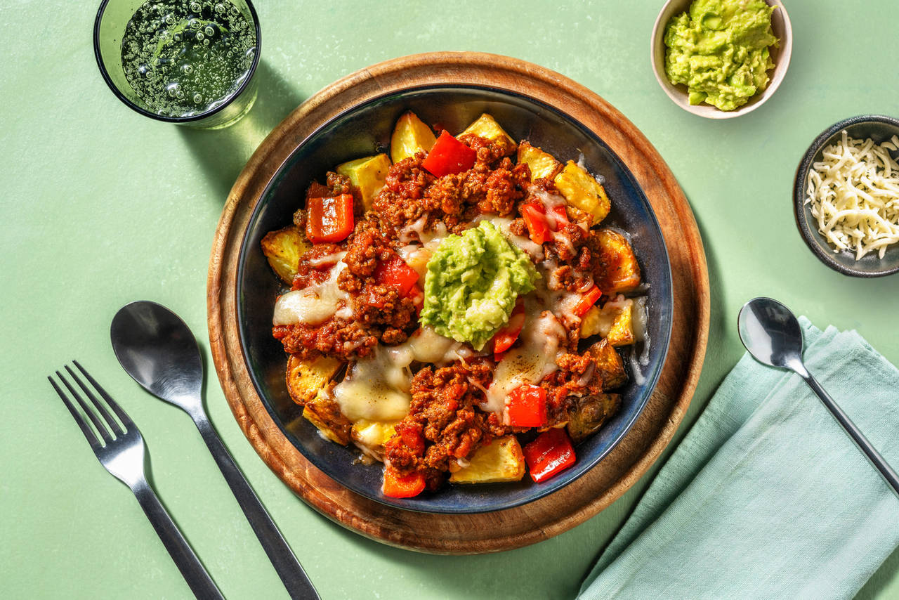 Ternera a la mexicana con queso fundido con base de patatas y guacamole casero