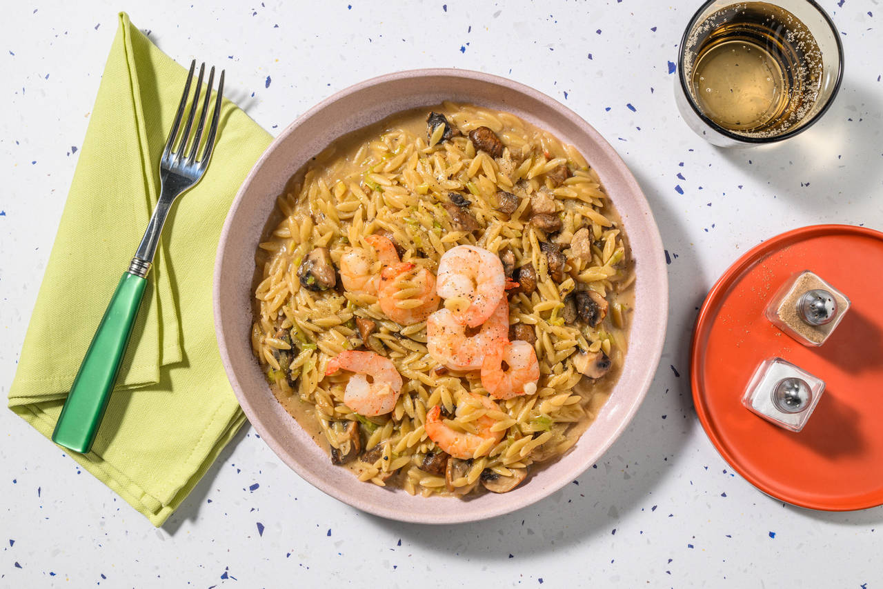 Risotto cremoso de langostinos con orzo, setas portobello y queso pecorino