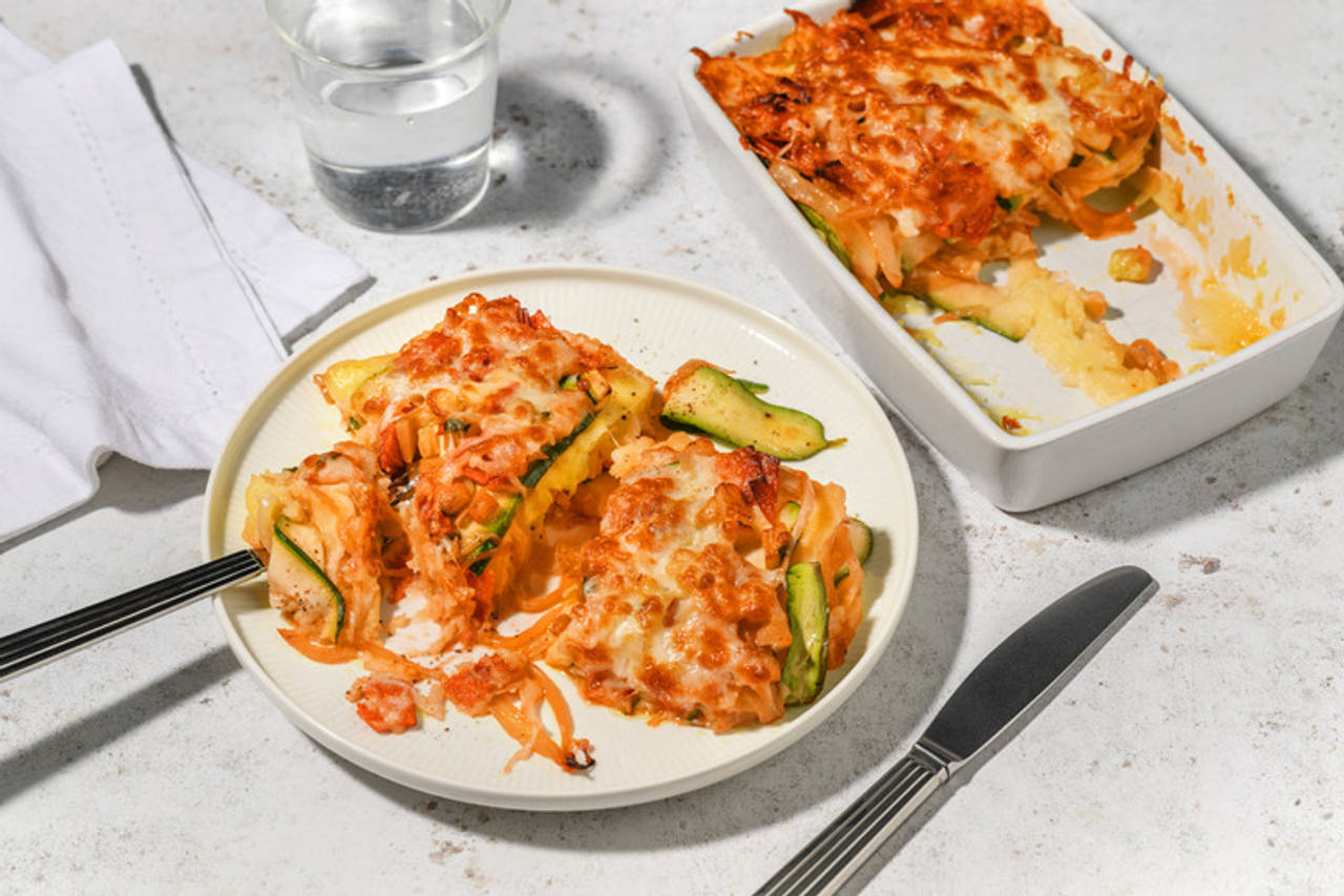 Pastel rojo de patata con sobrasada de Mallorca con calabacín y queso gratinado