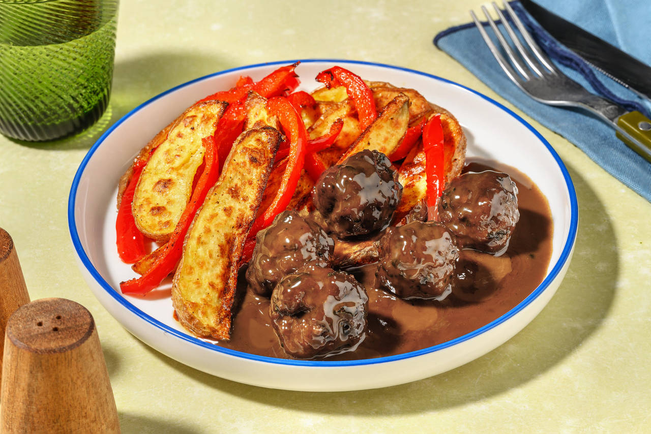 Albóndigas con salsa al estilo asiático con patatas y pimientos al horno