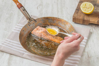 Spoon the lemon juice over the salmon