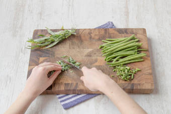 Finely chop the greens beans