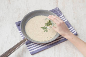 Add the crème fraîche to the pan, with the tarragon