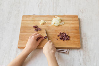 Chop garlic, onion and olives