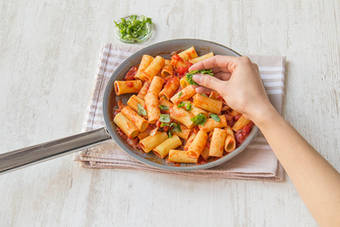 Stir the basil into the pasta