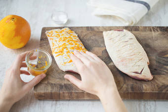 Rub orange into duck