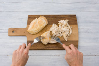 Shred the chicken into pieces