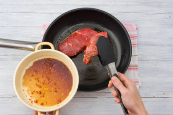 Add the steaks to the frying pan