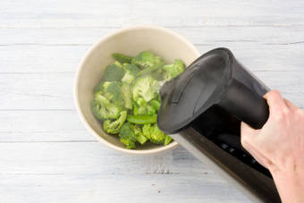 Pour the boiling water over the greens