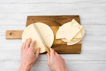 Cut the corn tortillas into triangles