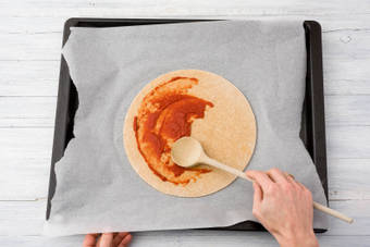 Spread the tomato paste