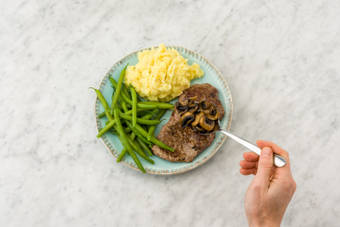 Top the steak with the mushroom sauce
