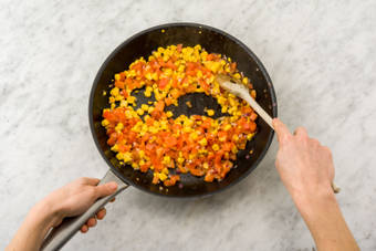 Cook the corn, tomato and red onion