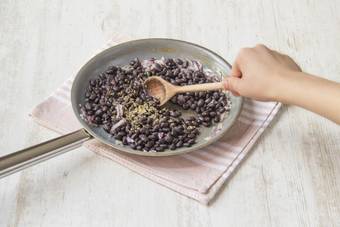 Cook the onions and beans