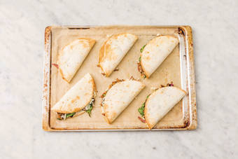 Flip the quesadillas