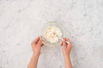 Toast pepitas and make lemony feta