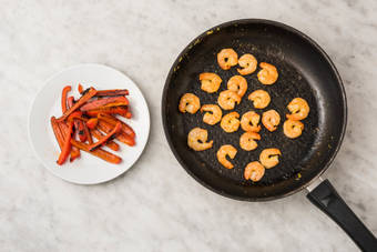 Cook peppers and shrimp