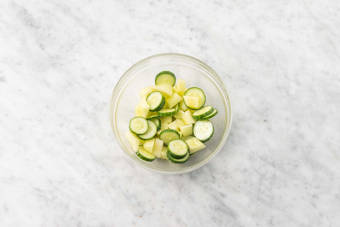 Marinate melon and cucumbers