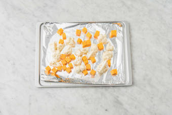 Broil squash and cauliflower