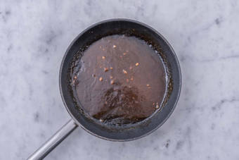 Make honey-garlic sauce and heat pitas