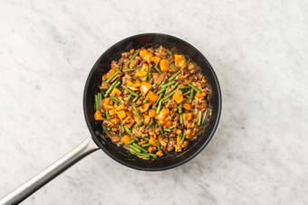 Cook veggies and finish pork