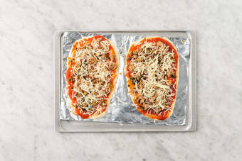 Assemble and bake pizzas