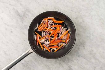 Cook peppers and onions