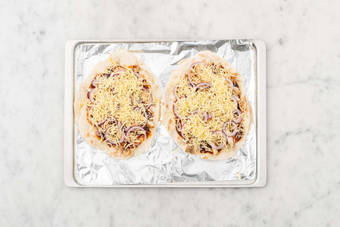 Assemble and bake pizzas