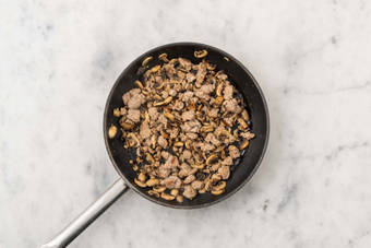 Cook sausage and mushrooms