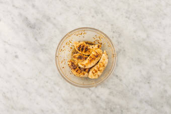 Season and grill chicken